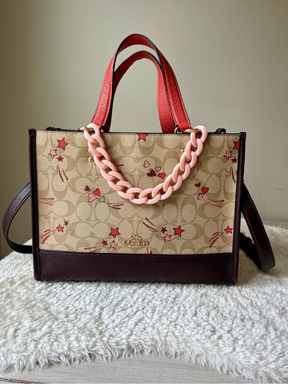 Coach Dempsey Carryall bag With Heart And Star Print print and chain charm